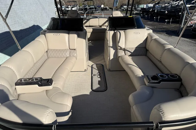 Slide: The Image of 2019 Harris Solstice DC 230 pontoon boat with luxurious beige seating and cup holders. - 13