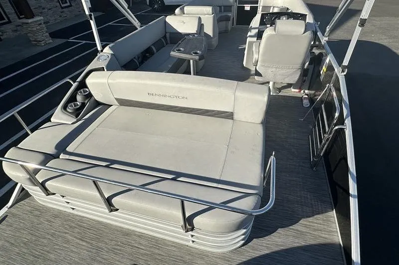 Slide: The Image of 2021 Bennington 23 LSB pontoon boat interior with spacious seating and modern design. - 4