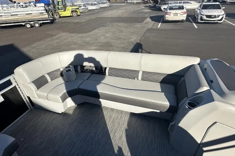 Slide: The Image of 2021 Bennington 23 LSB pontoon boat interior with gray seating and cup holders. - 5