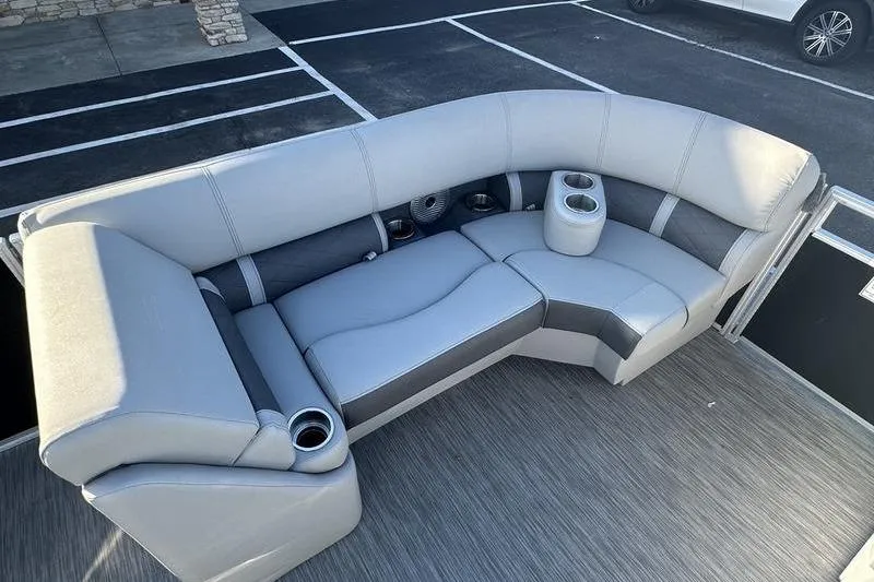 Slide: The Image of 2021 Bennington 23 LSB boat interior with gray seating and cup holders. - 7