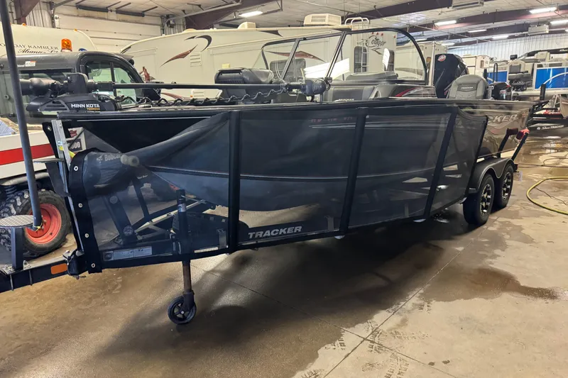 The Image of 2020 Tracker Targa V-19 Combo Tournament Edition boat in indoor storage. - 1