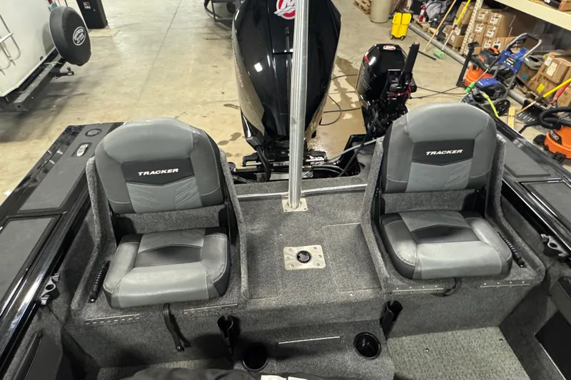 Slide: The Image of 2020 Tracker Targa V-19 Combo Tournament Edition boat interior with two seats and motor. - 13