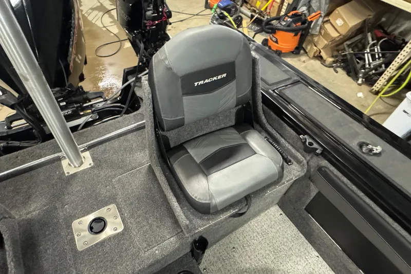 Slide: The Image of 2020 Tracker Targa V-19 Combo Tournament Edition boat seat in a garage setting. - 15