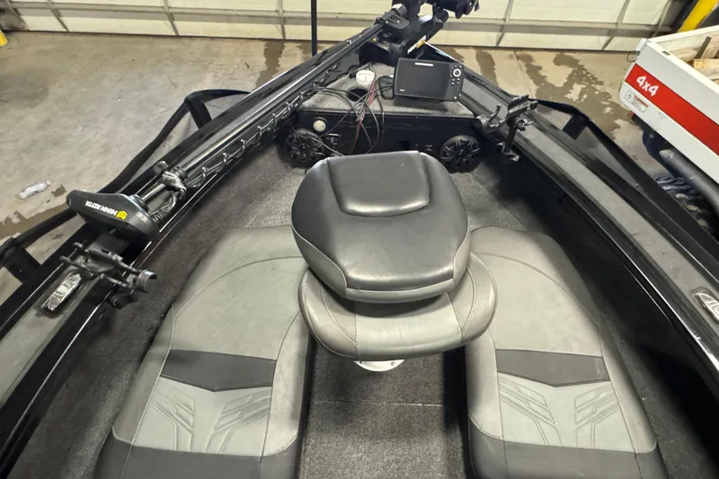 Slide: The Image of 2020 Tracker Targa V-19 Combo Tournament Edition boat interior with seating and equipment. - 18