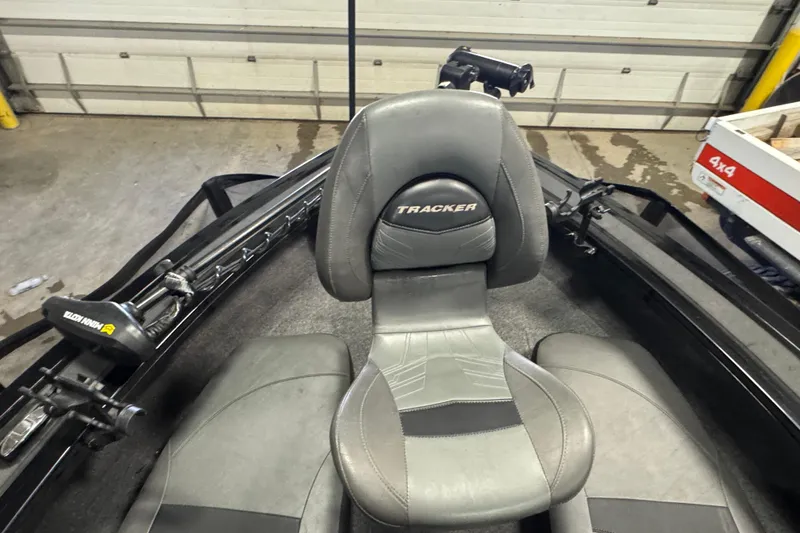 Slide: The Image of 2020 Tracker Targa V-19 Combo Tournament Edition boat seat in a garage setting. - 19