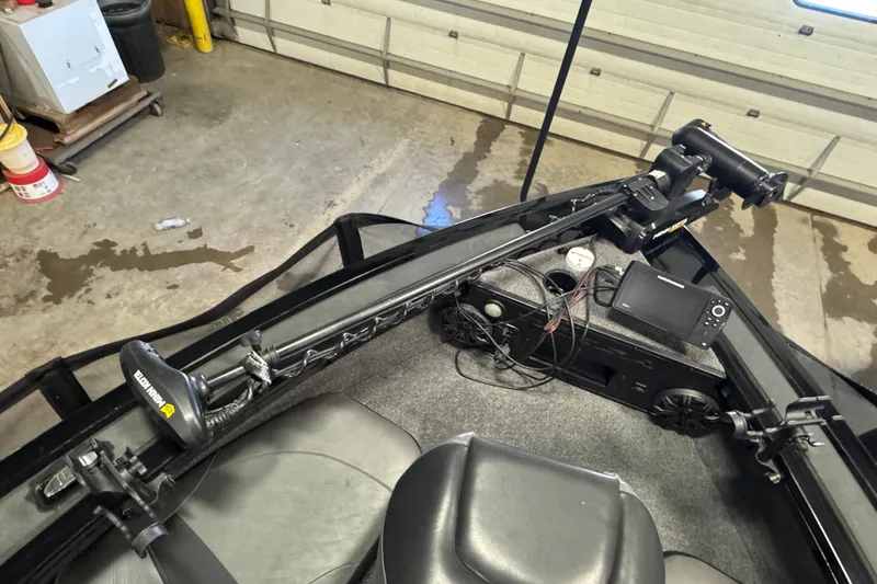 Slide: The Image of 2020 Tracker Targa V-19 Combo Tournament Edition boat interior with fishing equipment. - 21