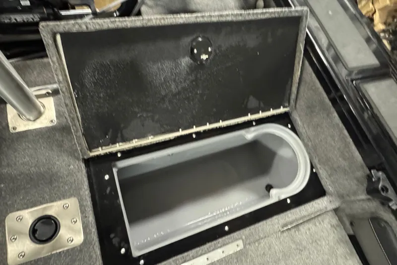 Slide: The Image of Open storage compartment in 2020 Tracker Targa V-19 Combo Tournament Edition boat. - 25