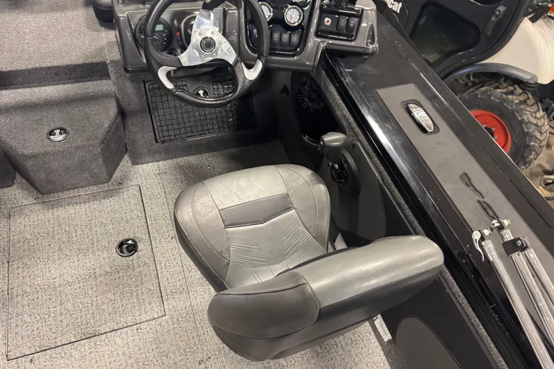 Slide: The Image of 2020 Tracker Targa V-19 Combo Tournament Edition boat interior with steering wheel and seat. - 7