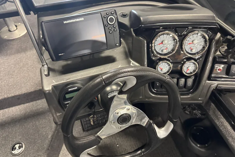 Slide: The Image of 2020 Tracker Targa V-19 Combo boat dashboard with steering wheel and gauges. - 8