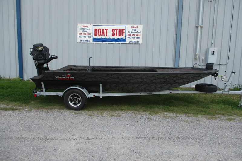 The Image of 2026 Gator Tail 1754 Extreme boat on trailer outside dealership. - 0