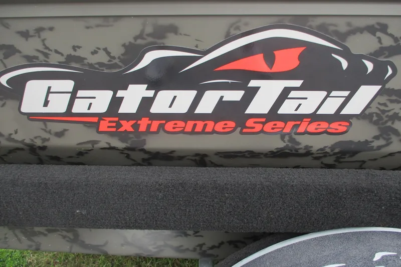 Slide: The Image of Gator Tail 1754 Extreme Series logo on camouflage background, 2026 model. - 11