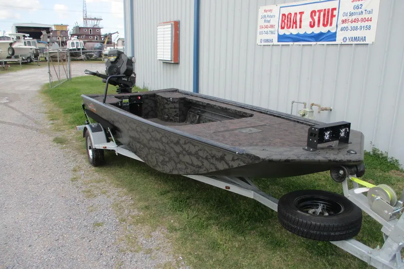 Slide: The Image of 2026 Gator Tail 1754 Extreme boat on trailer outside dealership. - 3