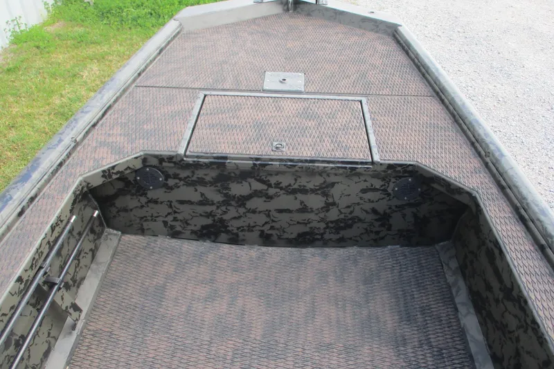 Slide: The Image of 2026 Gator Tail 1754 Extreme boat interior with camo pattern and storage compartments. - 6