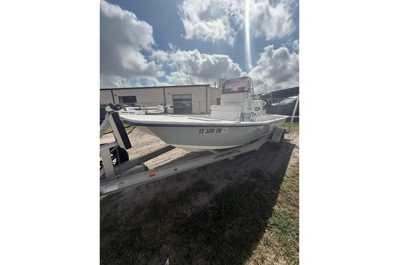 Slide: The Image of 2019 Shoalwater 20 Catamaran on trailer under cloudy sky. - 3