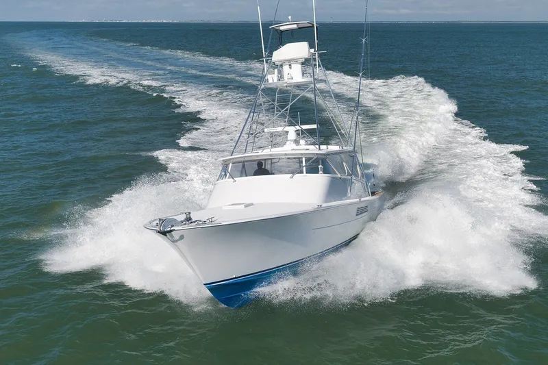 The Image of Merritt 48 yacht cruising on open water, 1998 model, creating a dynamic wake. - 0