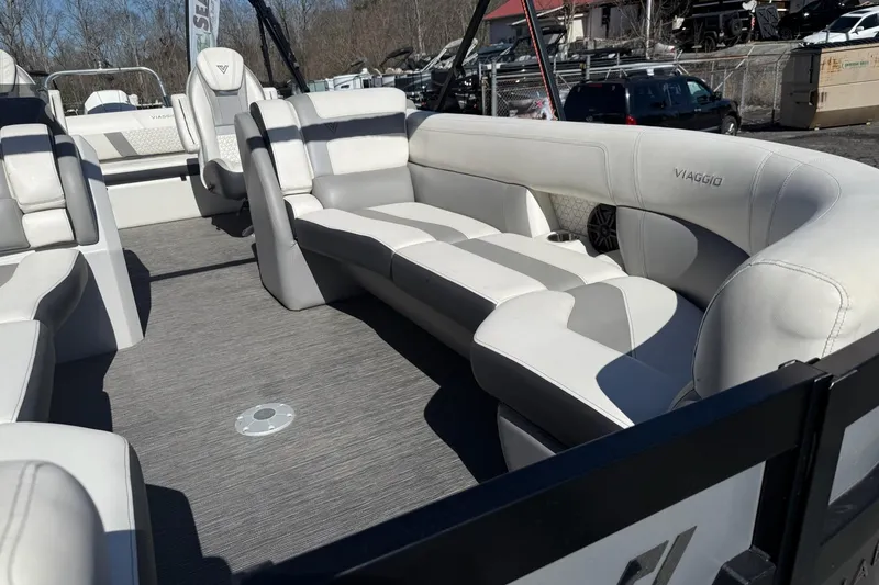 Slide: The Image of 2022 Viaggio Diamante S 26 boat interior with luxurious white seating and modern design. - 7