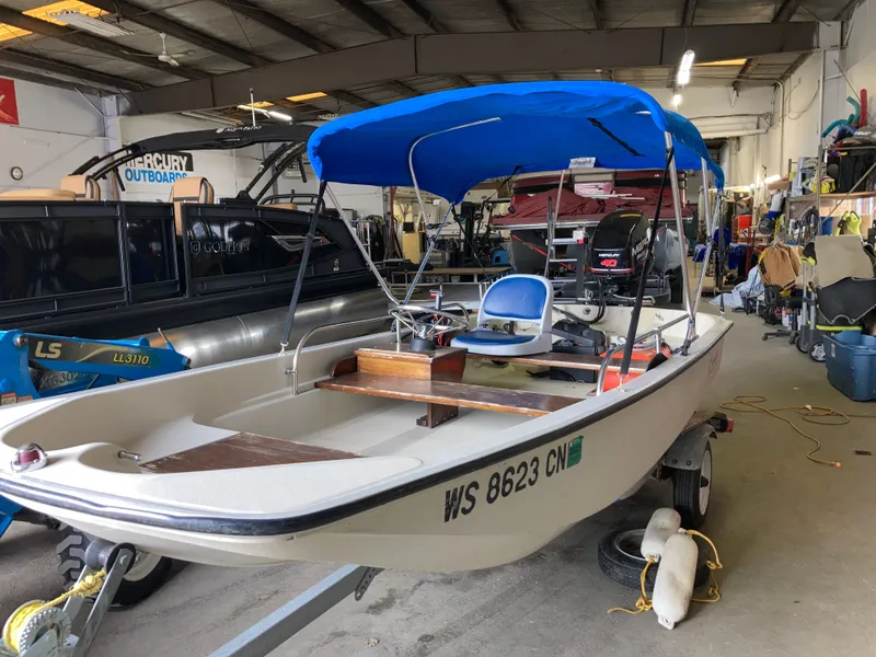 The Image of 1989 Boston Whaler 13 Sport boat in a workshop. - 0