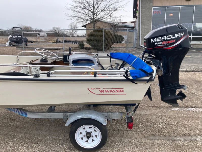 Slide: The Image of 1989 Boston Whaler 13 Sport with Mercury outboard motor. - 11