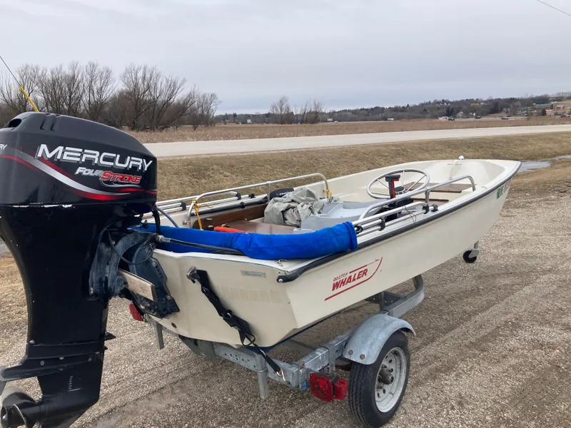 Slide: The Image of 1989 Boston Whaler 13 Sport with Mercury outboard motor on trailer. - 12