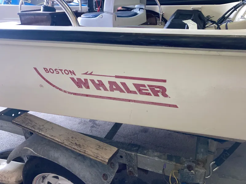 Slide: The Image of 1989 Boston Whaler 13 Sport boat on trailer. - 15