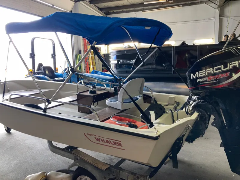 Slide: The Image of 1989 Boston Whaler 13 Sport boat with Mercury outboard motor. - 2