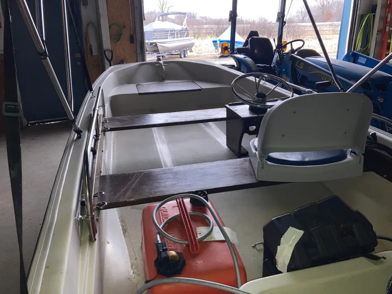 Slide: The Image of 1989 Boston Whaler 13 Sport boat in storage facility. - 5