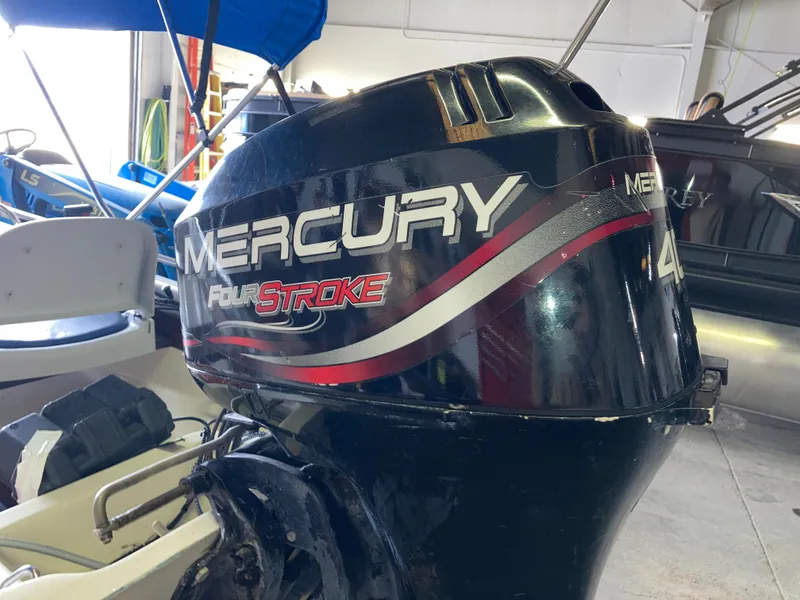 Slide: The Image of Mercury FourStroke engine on a 1989 Boston Whaler 13 Sport boat. - 6