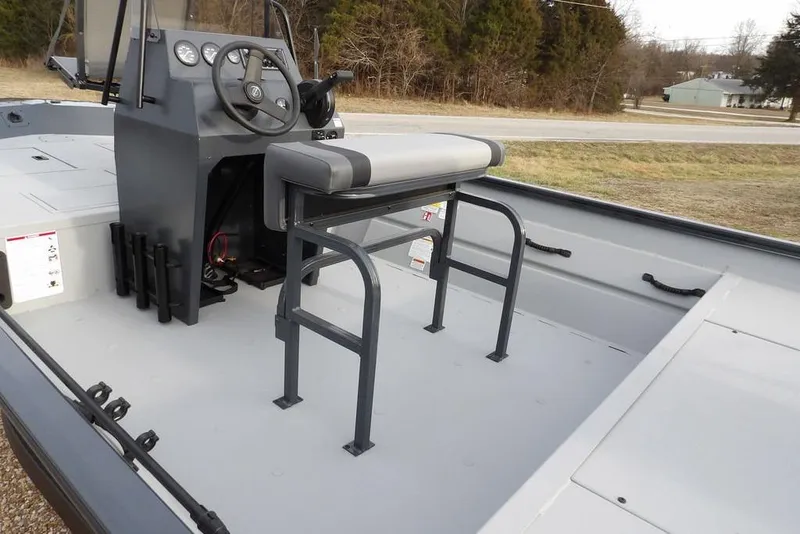 Slide: The Image of 2026 Crestliner 1870 Retriever FCC boat interior with steering console and seating. - 10