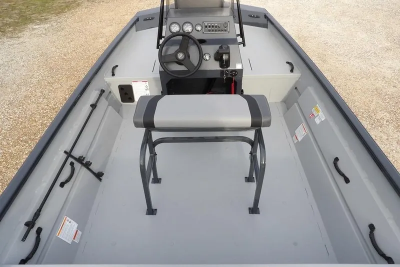 Slide: The Image of 2026 Crestliner 1870 Retriever FCC boat interior with steering console and seating. - 11