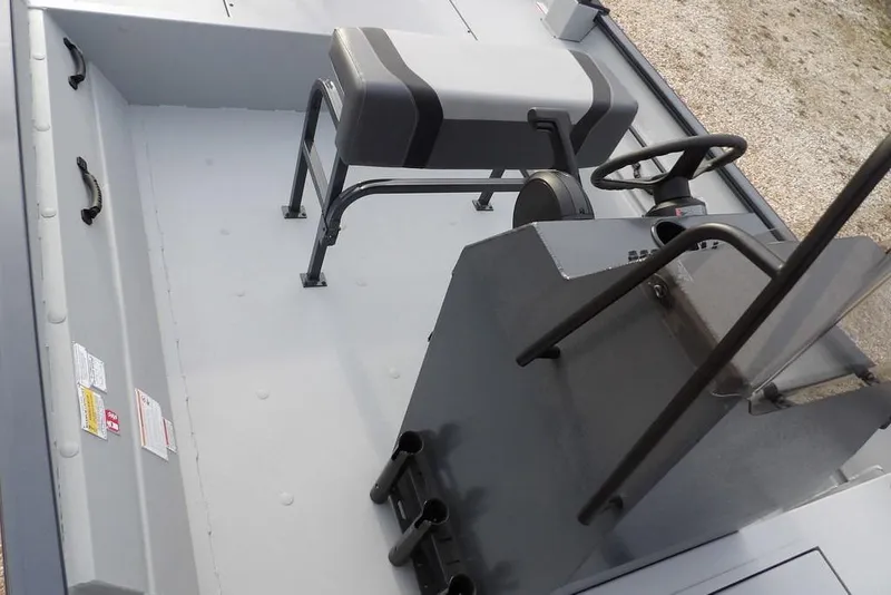 Slide: The Image of 2026 Crestliner 1870 Retriever FCC boat interior with steering console and seating. - 23