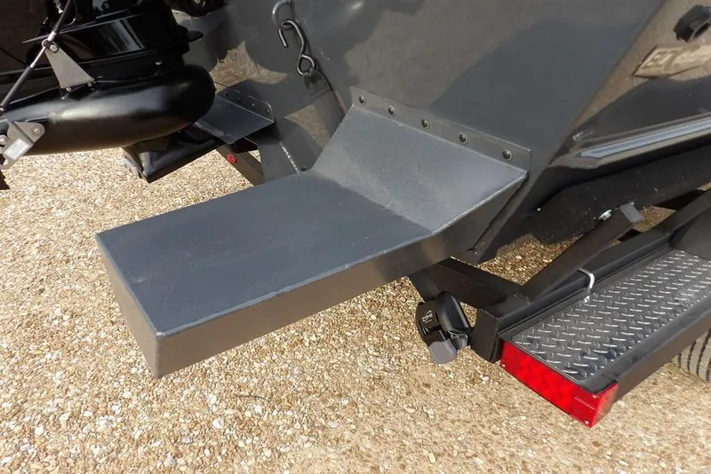 Slide: The Image of 2026 Crestliner 1870 Retriever FCC boat trailer detail with step and tail light. - 27