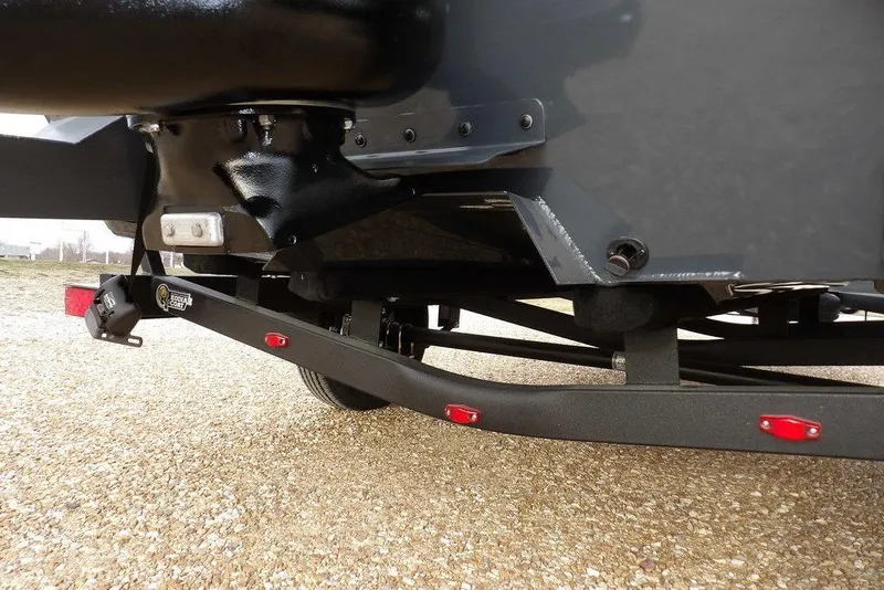 Slide: The Image of 2026 Crestliner 1870 Retriever FCC boat trailer detail with black frame and red reflectors. - 28