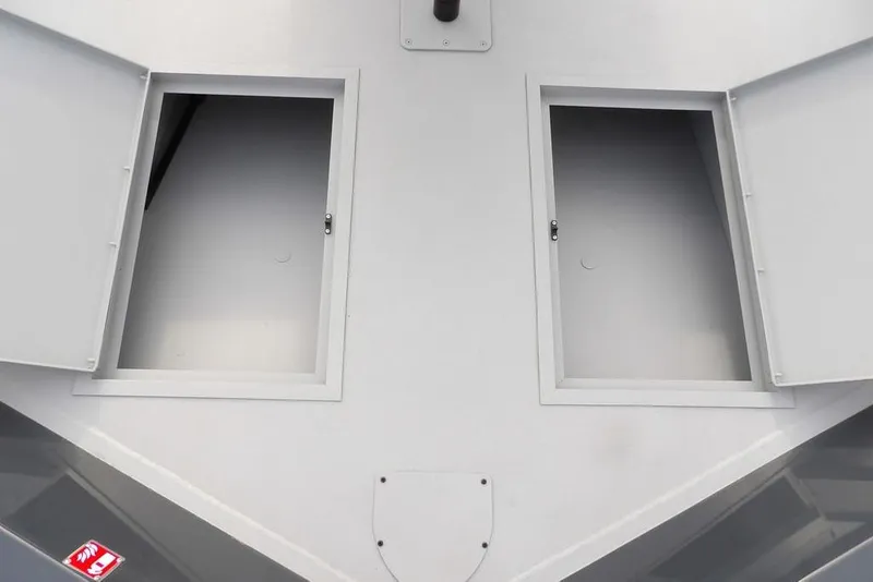 Slide: The Image of 2026 Crestliner 1870 Retriever FCC boat storage compartments open for access. - 29