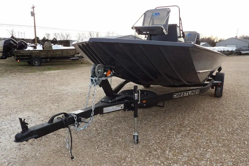 Slide: The Image of 2026 Crestliner 1870 Retriever FCC boat on trailer, parked on gravel. - 35