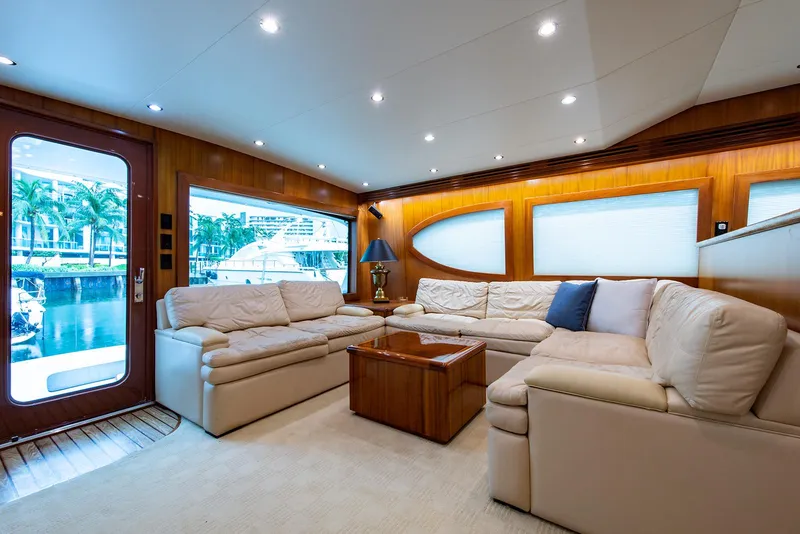 Slide: The Image of Luxurious interior of 2006 Hatteras 64 Convertible yacht with plush seating and elegant decor. - 10
