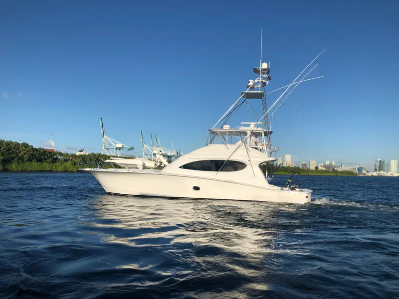Slide: The Image of 2006 Hatteras 64 Convertible yacht cruising on a sunny day. - 3