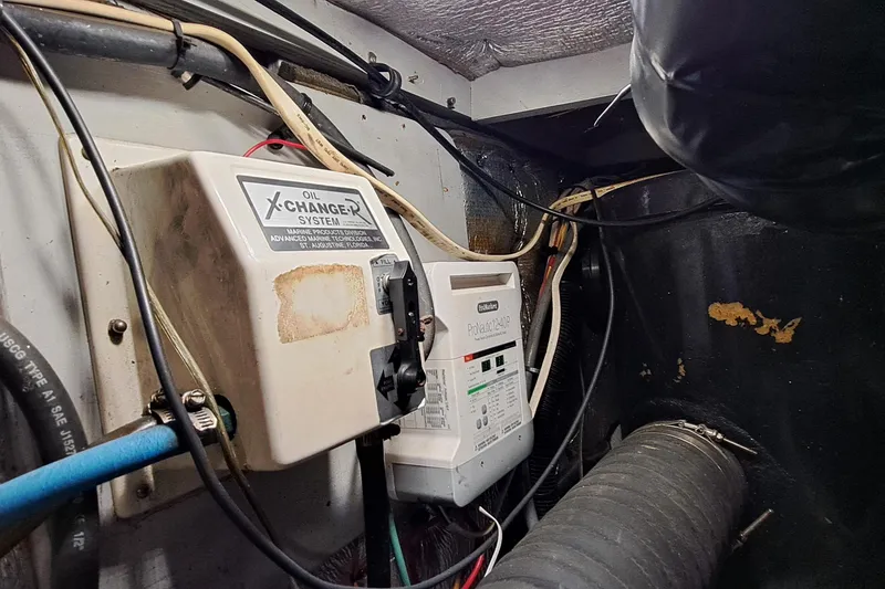 Slide: The Image of Engine room of 2000 Silverton 42 Convertible with oil change system and wiring. - 20