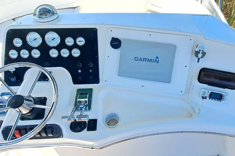 Slide: The Image of Control panel of 2000 Silverton 42 Convertible boat with Garmin navigation system. - 9