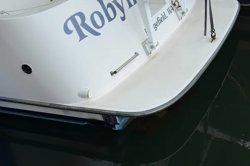 Slide: The Image of 1994 Tollycraft 45 Cockpit Motor Yacht stern view at dock. - 12