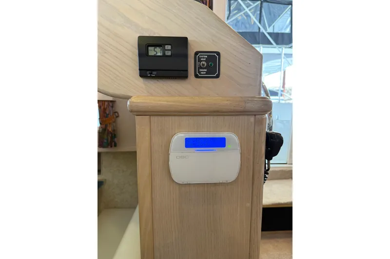 Slide: The Image of Control panel inside 1994 Tollycraft 45 Cockpit Motor Yacht, featuring digital display and system controls. - 49