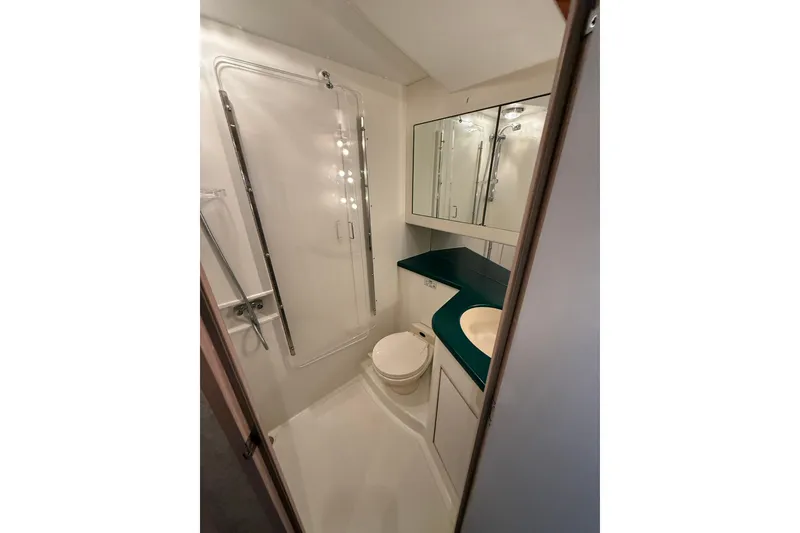 Slide: The Image of Bathroom interior of 1994 Tollycraft 45 Cockpit Motor Yacht with shower and vanity. - 54
