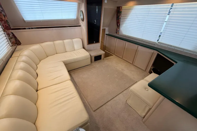 Slide: The Image of Luxurious interior of 1994 Tollycraft 45 Cockpit Motor Yacht with cream leather seating. - 55