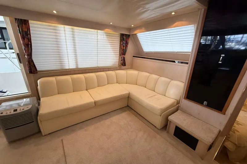 Slide: The Image of Luxurious interior of 1994 Tollycraft 45 Cockpit Motor Yacht with cream leather seating. - 57