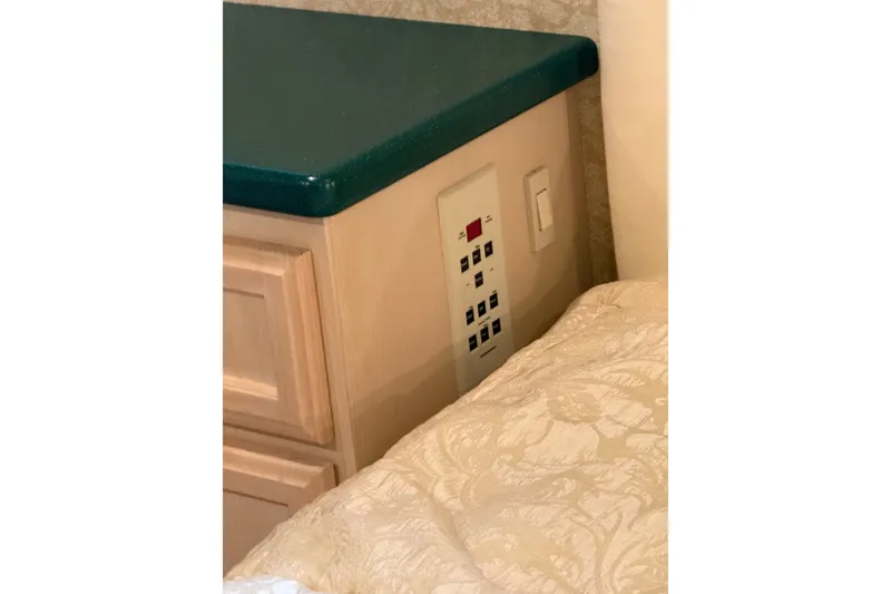 Slide: The Image of Control panel and cabinetry inside a 1994 Tollycraft 45 Cockpit Motor Yacht. - 61