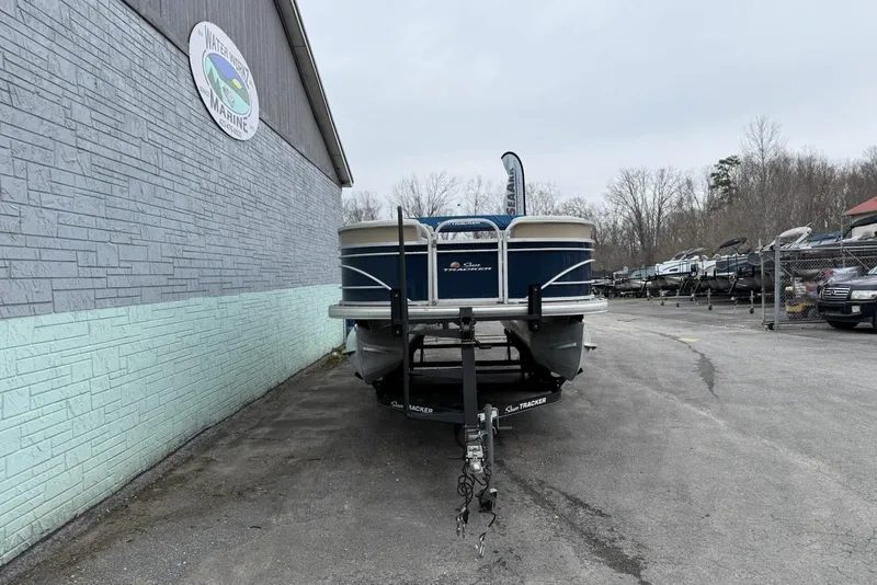 Slide: The Image of 2020 Sun Tracker Party Barge 20 DLX pontoon boat on trailer at dealership. - 2