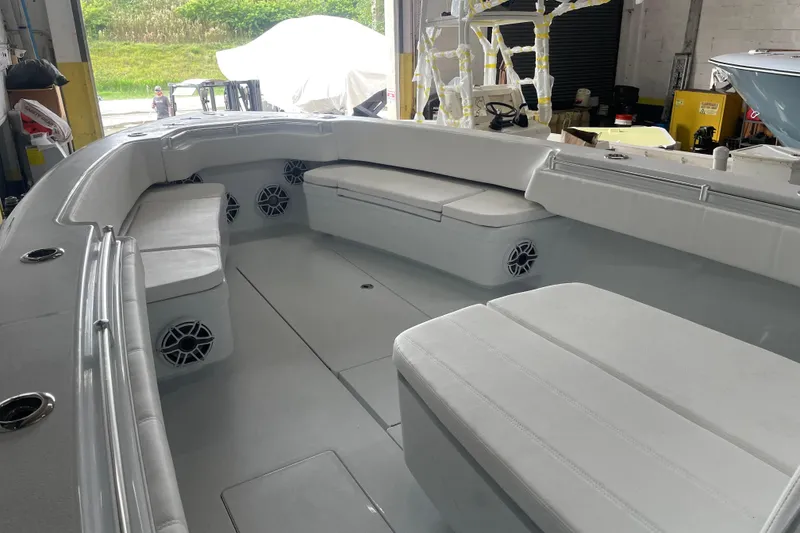 Slide: The Image of 2024 Contender 39 ST boat console with dual screens and steering wheel. - 10