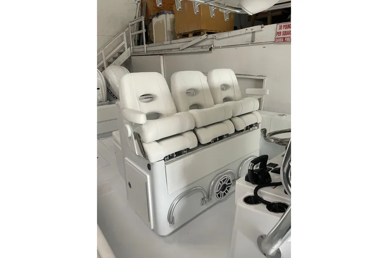 Slide: The Image of 2024 Contender 39 ST boat interior with white seating and spacious layout. - 12