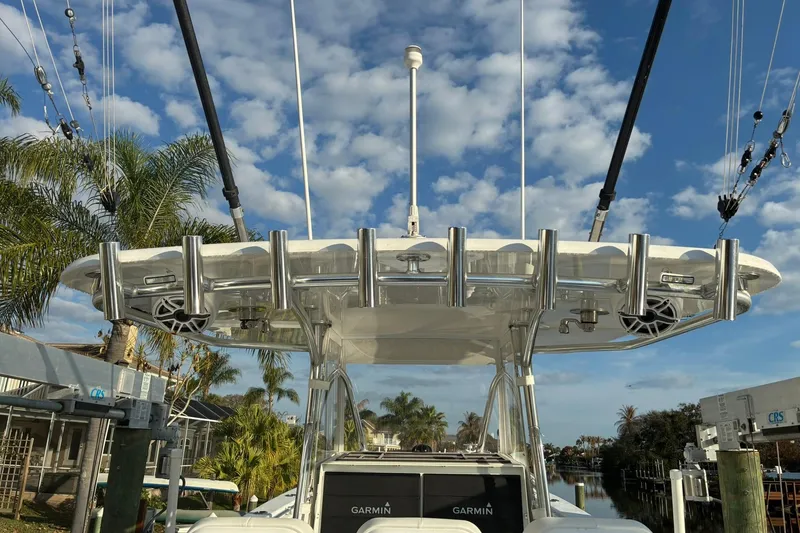 Slide: The Image of 2024 Contender 39 ST boat engine compartment with hydraulic components and hoses. - 15