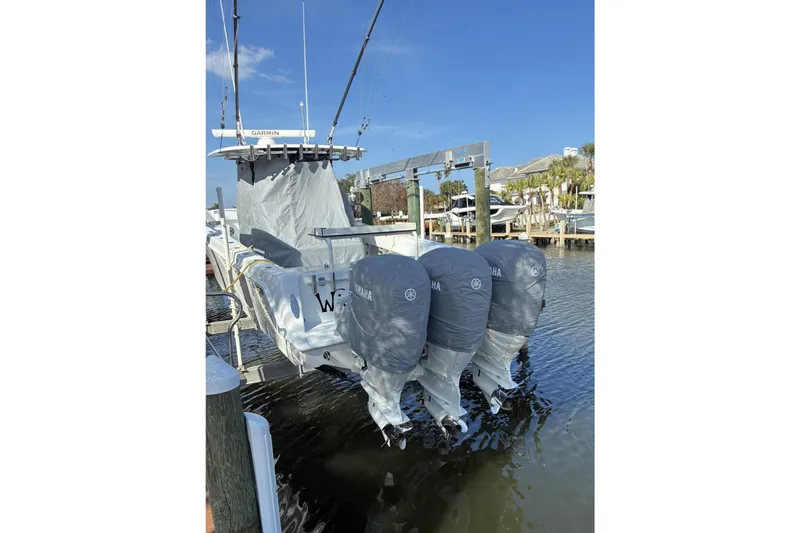 Slide: The Image of 2024 Contender 39 ST boat interior cabin with compact toilet and sink. - 20