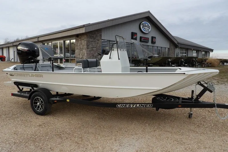 The Image of 2026 Crestliner 1870 Retriever FCC boat on trailer outside dealership. - 1